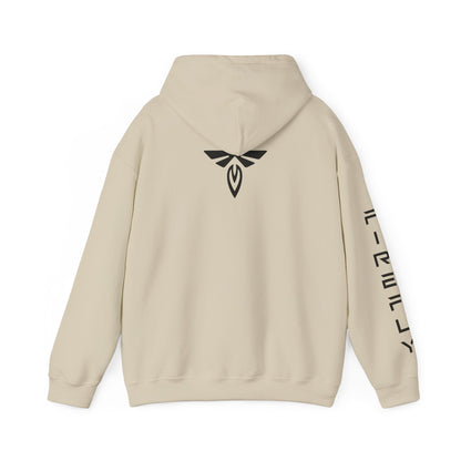 A beige pullover hoodie shown from the back, featuring a black stylized winged emblem centered on the upper back and black vertical text printed down one sleeve, set against a plain white background.