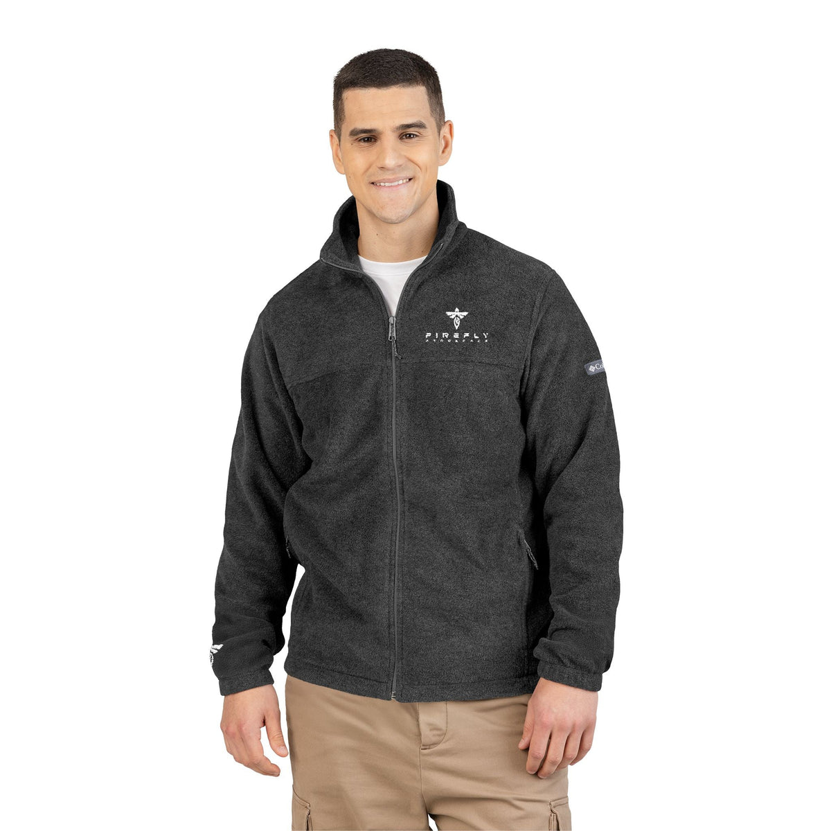 Man wearing a dark gray jacket with logos on a white background