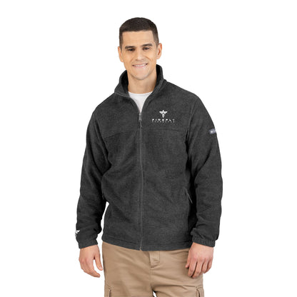Man wearing a dark gray jacket with logos on a white background