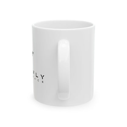 White mug with black line art design on a white background