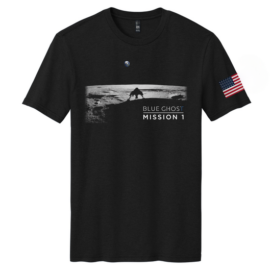 A black t-shirt featuring a graphic design of the Blue Ghost Moon Landing with a silhouette of the Moon's surface and an American flag, along with the text 'BLUE GHOST MISSION 1'.