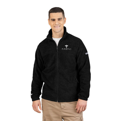 Man wearing a black jacket with logos on a white background